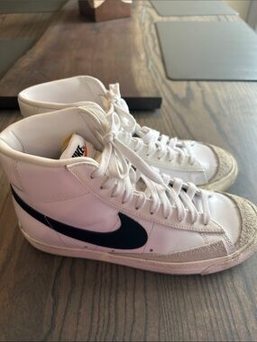 Nike White High-Top Sneakers with Black Swoosh